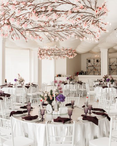 Photo of beautiful white wedding hall with big tables isolated